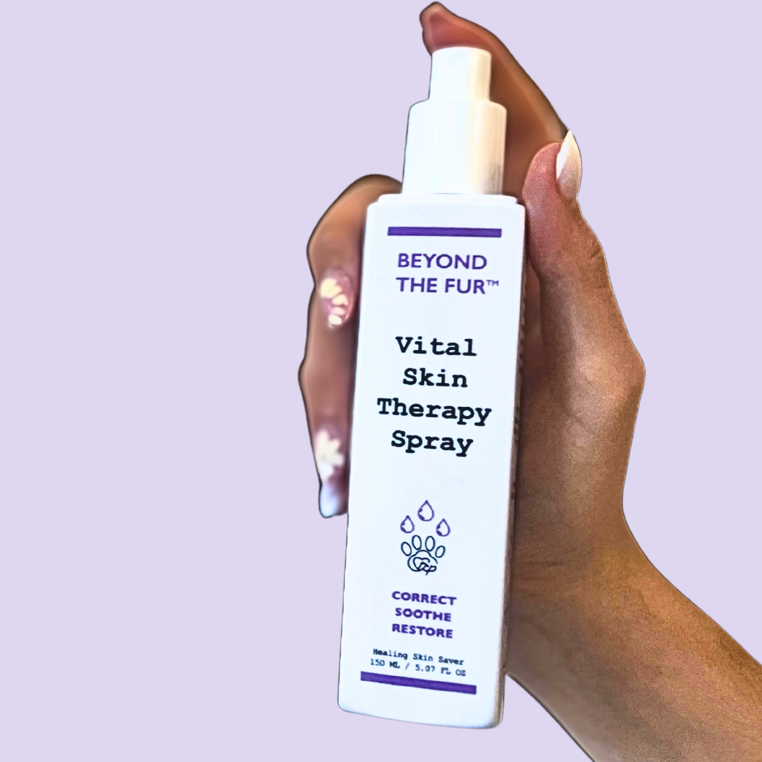 Hand holding a 'Beyond the Fur' Vital Skin Therapy Spray against a light purple background