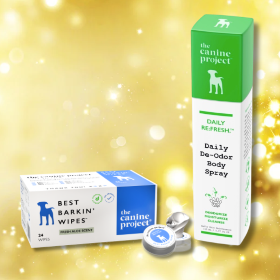 The Canine Project pet care products including wipes, body spray, and a container on a gold background.