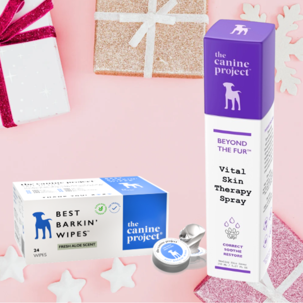 The Canine Project products including wipes and spray on a pink background with decorative elements.
